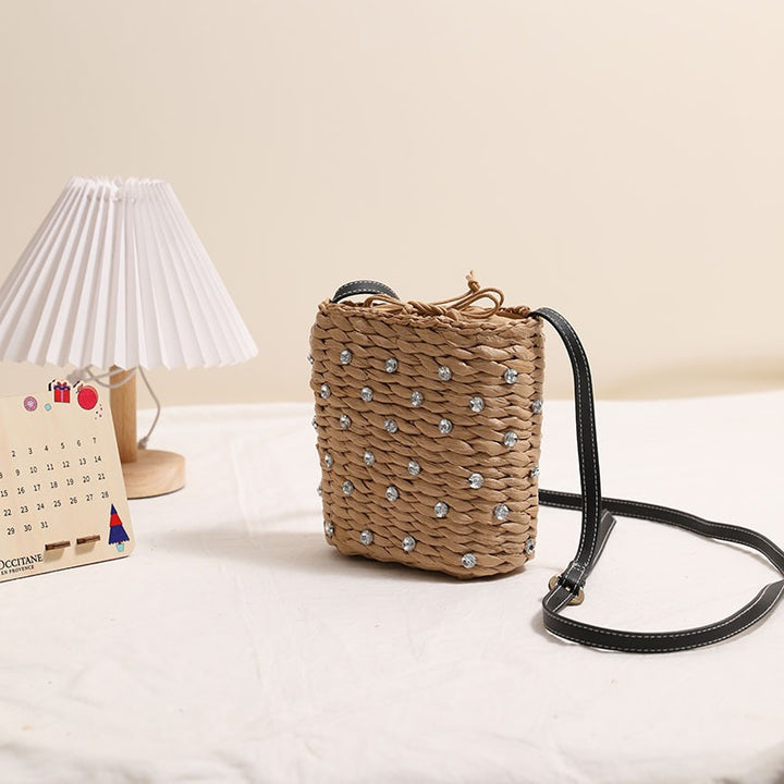 Bag made of woven natural material with sparkling appliqués Kalsten