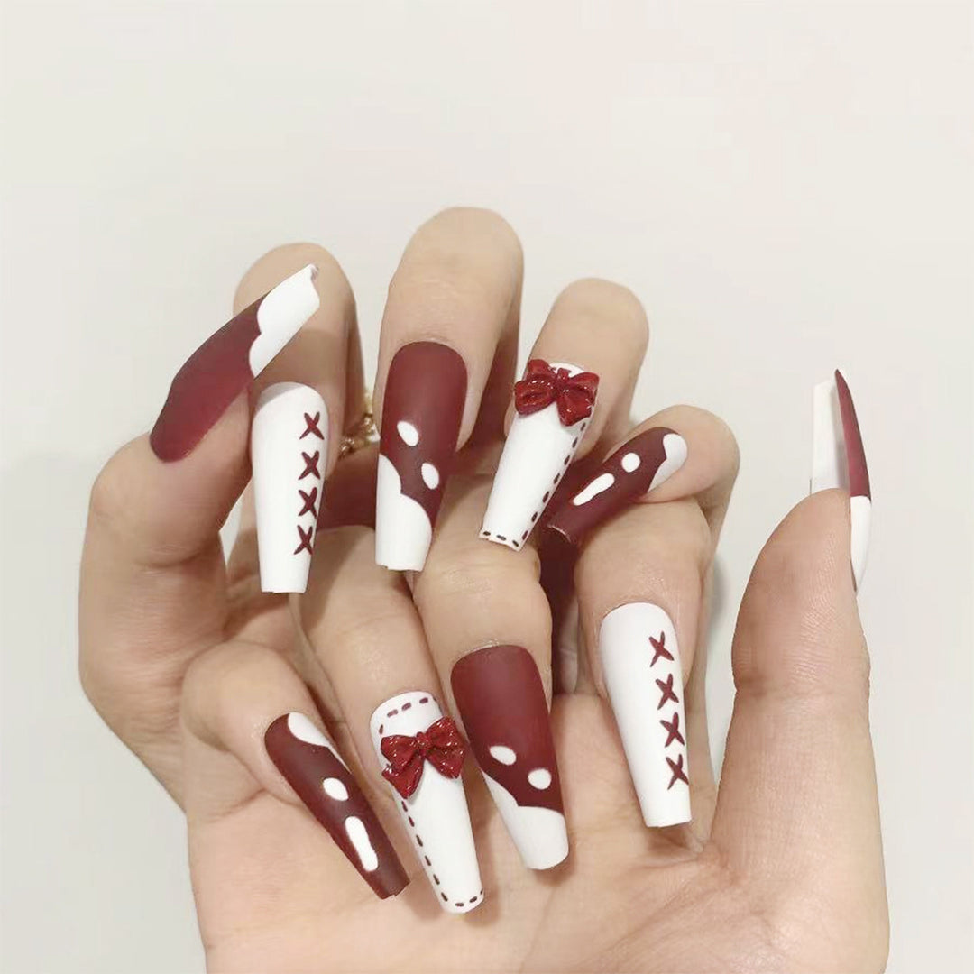 Artful stiletto nails with bow and zigzag design Kalsten