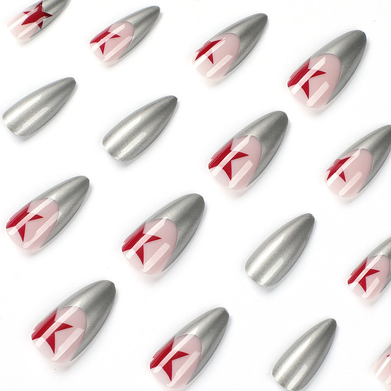 Artful stiletto nails with silver and star motifs Kalsten
