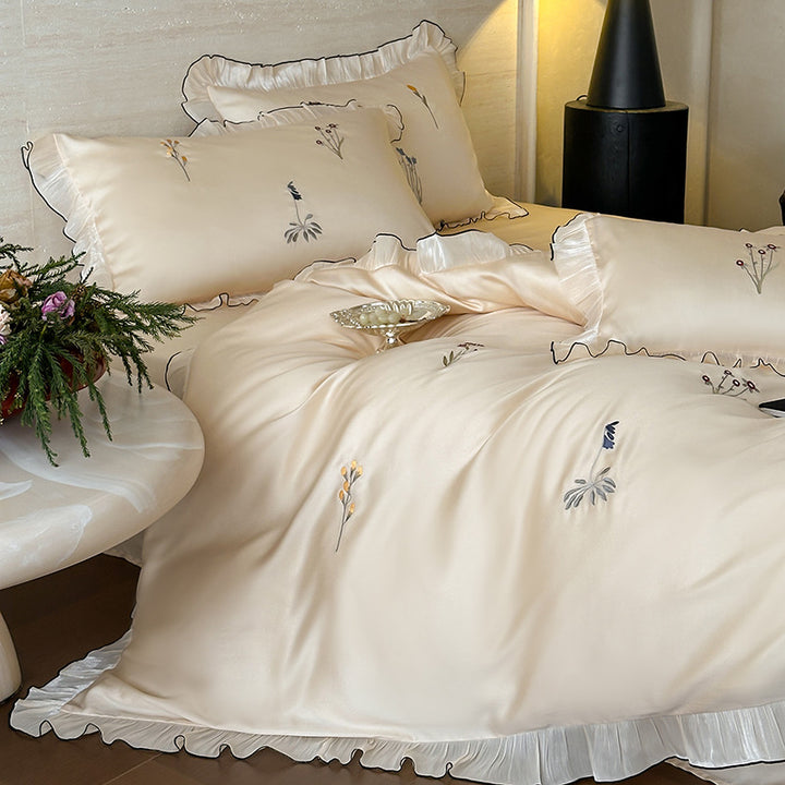 Satin bedding set with pleated frill and delicate embroidery