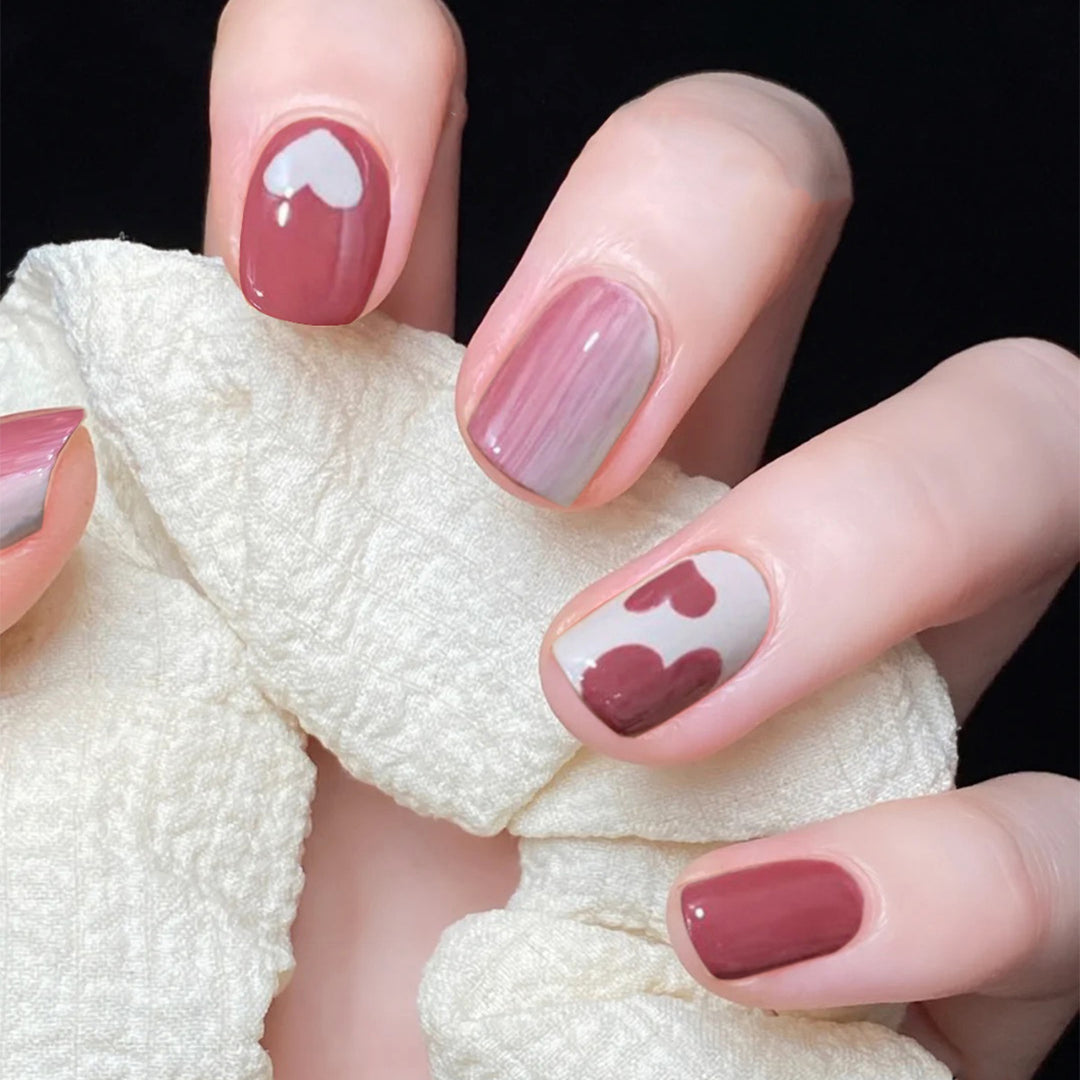 Creative nail art with heart motif and high-gloss finish Kalsten