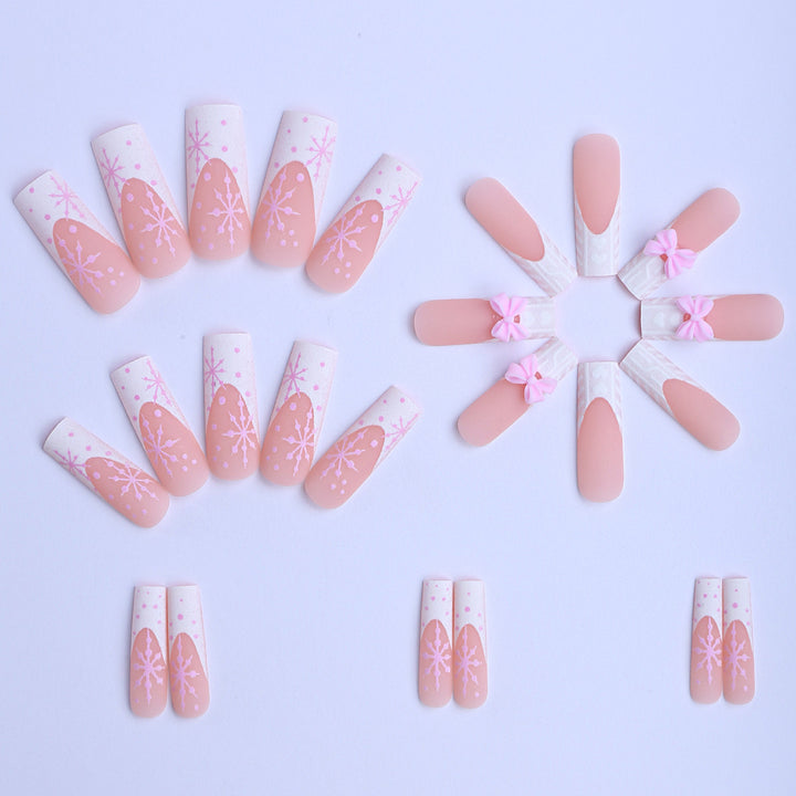 Artificial nail tips with playful bows and snowflake design Kalsten