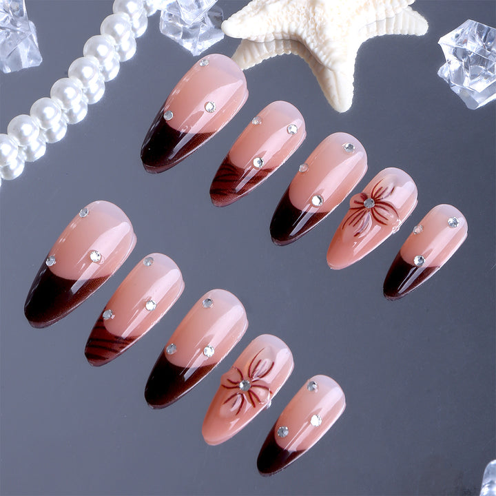 Artificial nails with elegant flower design and glitter accents Kalsten