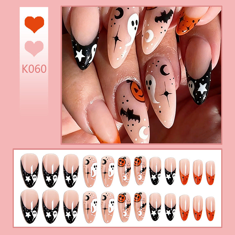 Halloween-themed artificial nails with ghost and pumpkin motifs Kalsten