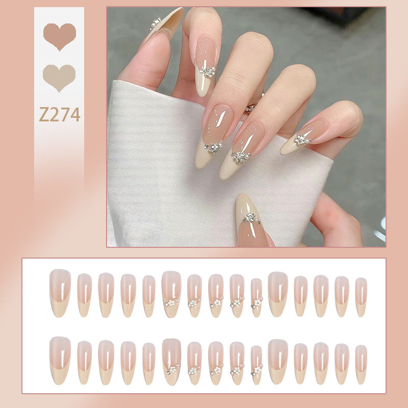 Acrylic nail set with elegant tips and sparkling appliqués Kalsten