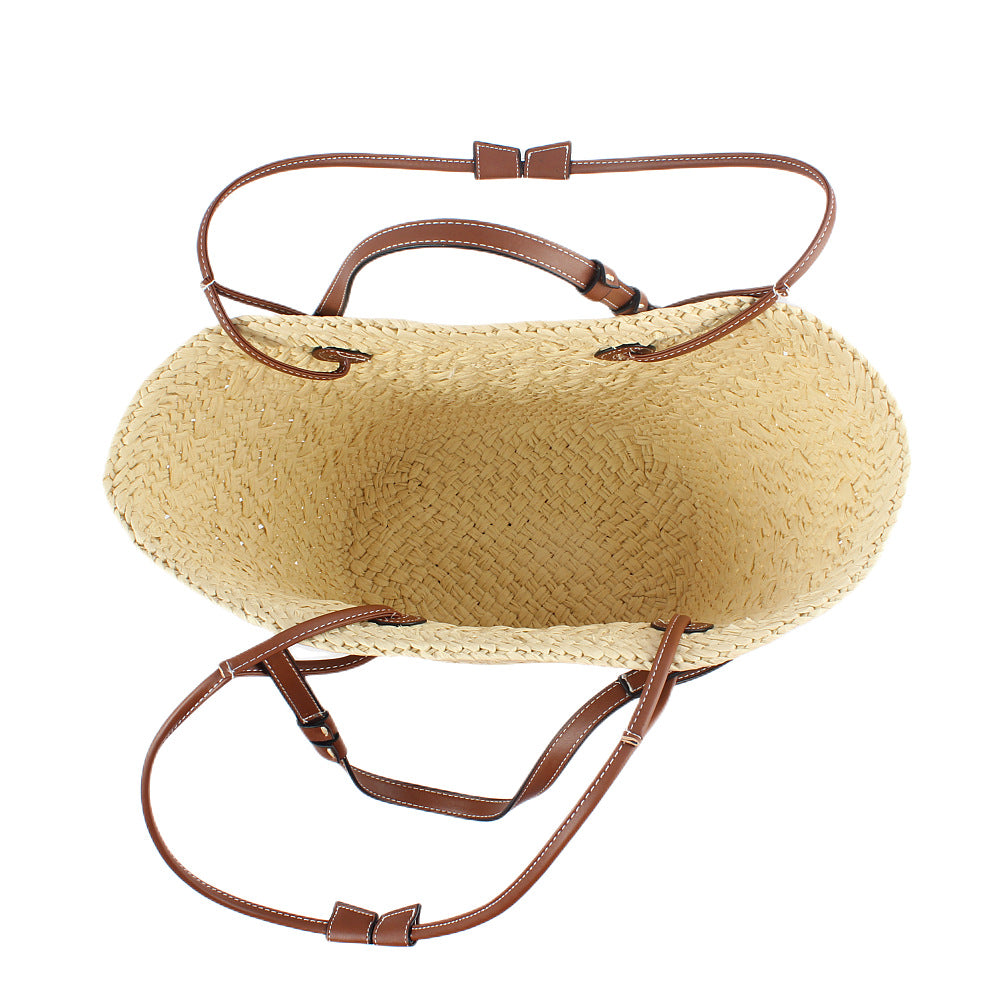 Elegant handbag made of woven natural material with sturdy leather handles Kalsten