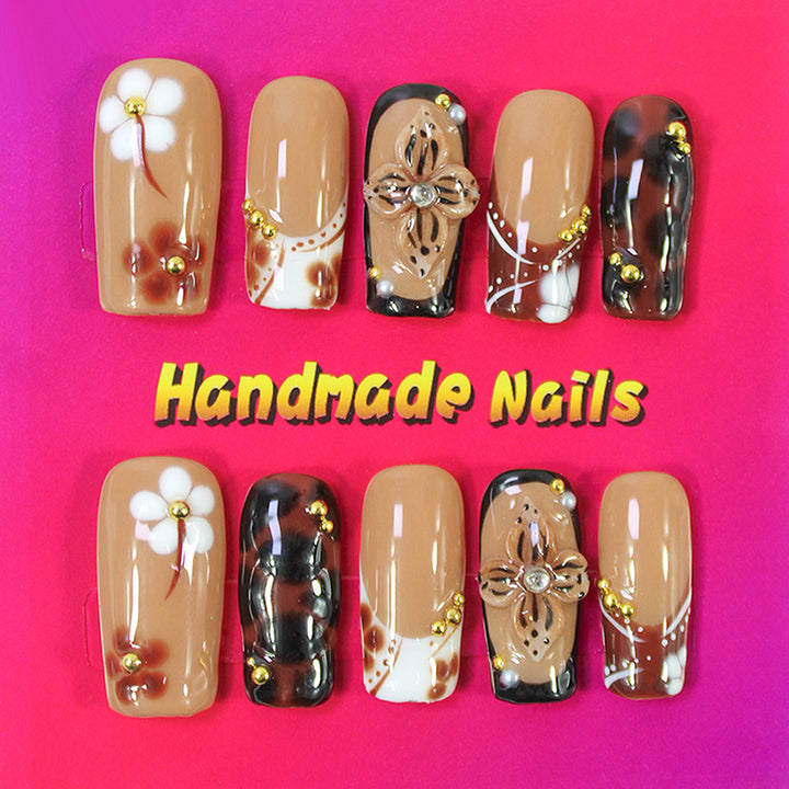 Acrylic nail set with elegant handcrafted designs and decorative accents Kalsten