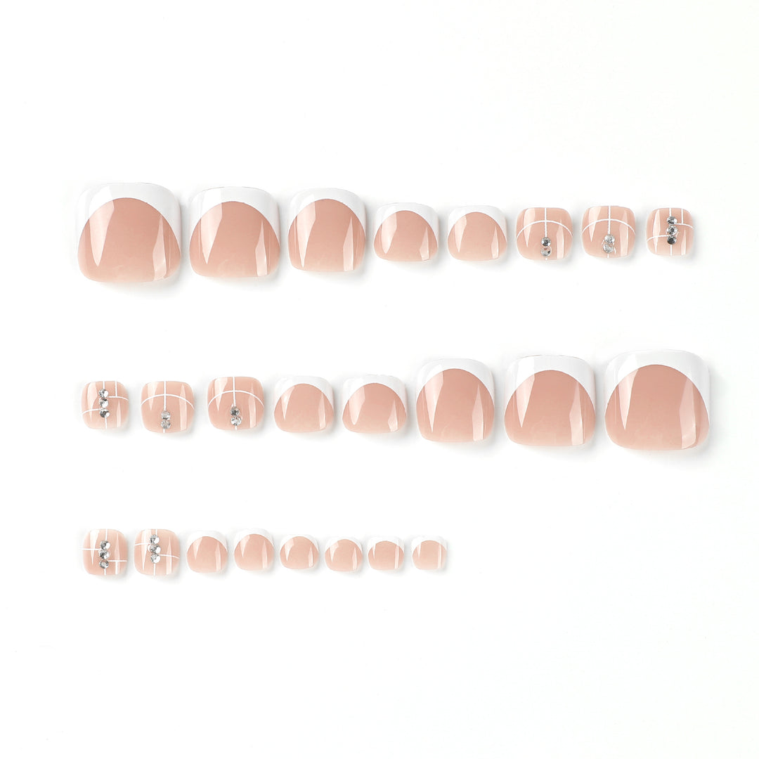 Artful toenail design with elegant style and rhinestone embellishments Kalsten