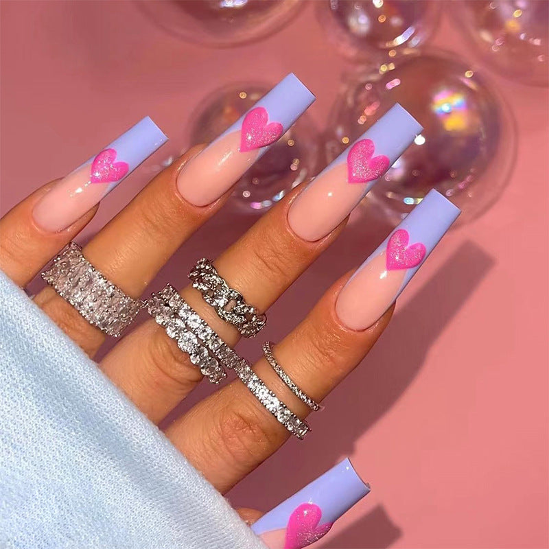 Artful stiletto nails with colorful heart designs Kalsten