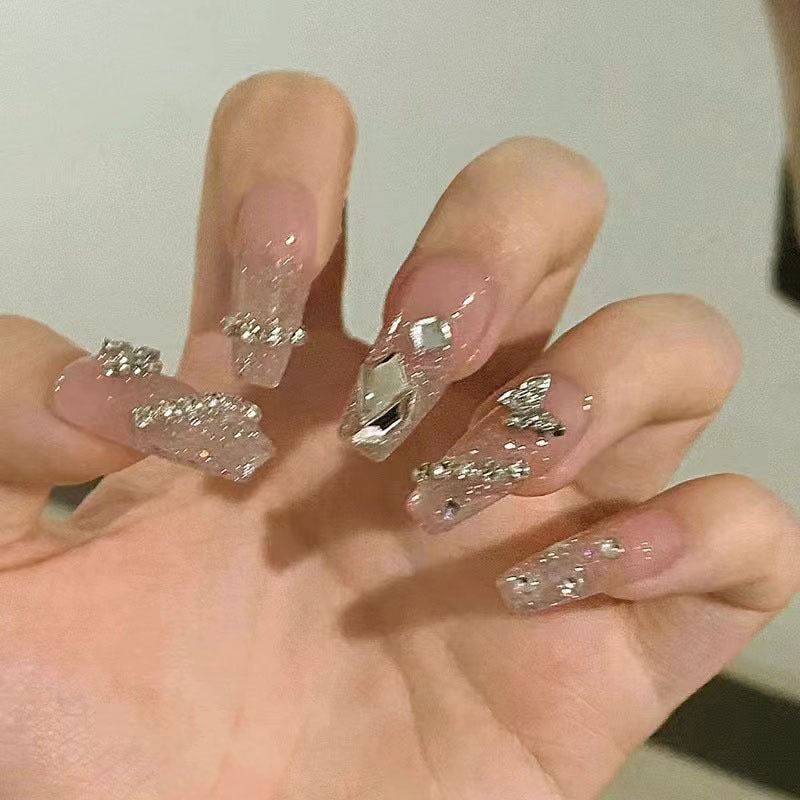 Glamorous artificial nails with sparkling rhinestones and elegant designs Kalsten