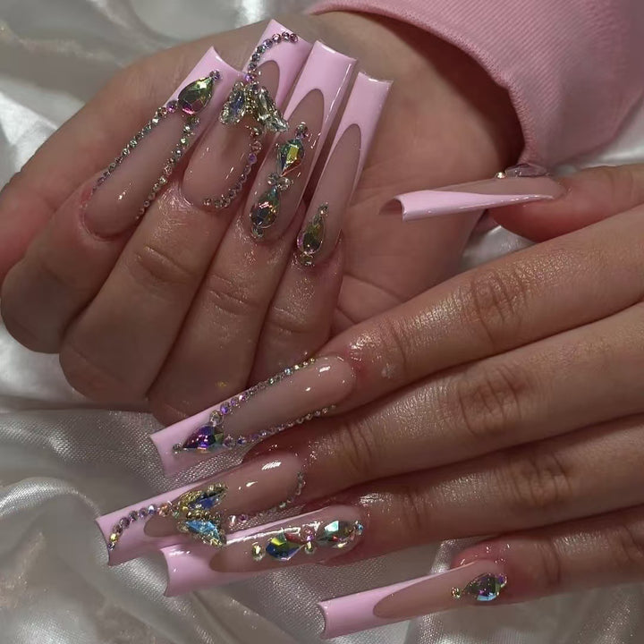 Acrylic nail set with elegant glitter and rhinestone accents Kalsten