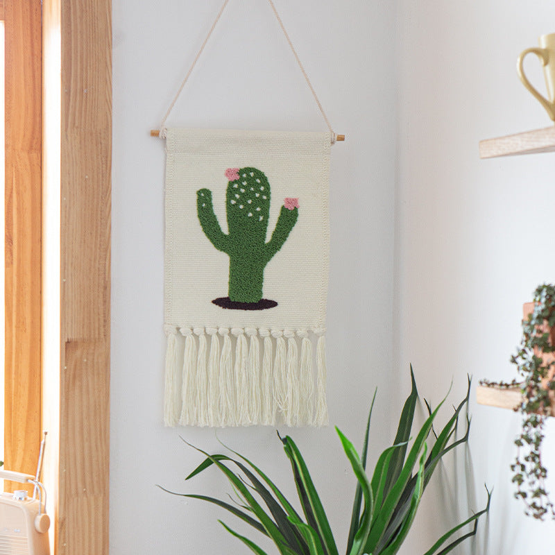 Woven cotton blend wall hanging with tufted cactus motif and cotton fringes Kalsten
