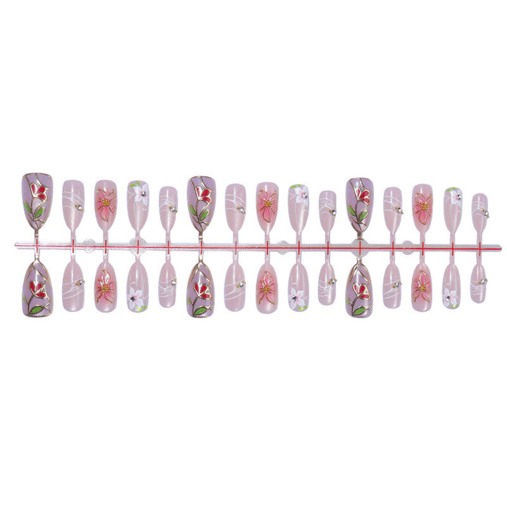 Nail art set with filigree floral decorations and shiny details Kalsten
