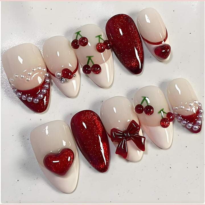 Artificial nail set with romantic berry designs and glamorous embellishments Kalsten