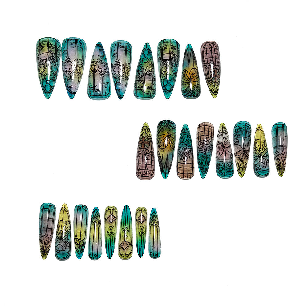 Artificial nails in elegant stiletto design with elaborate motifs Kalsten