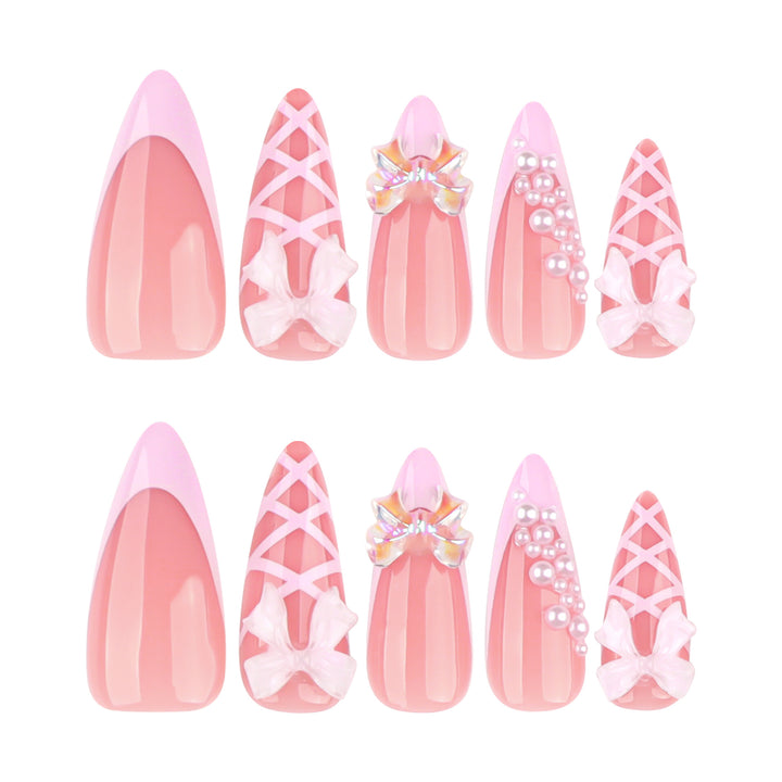 Artful stiletto nails with glitter and bow decoration Kalsten