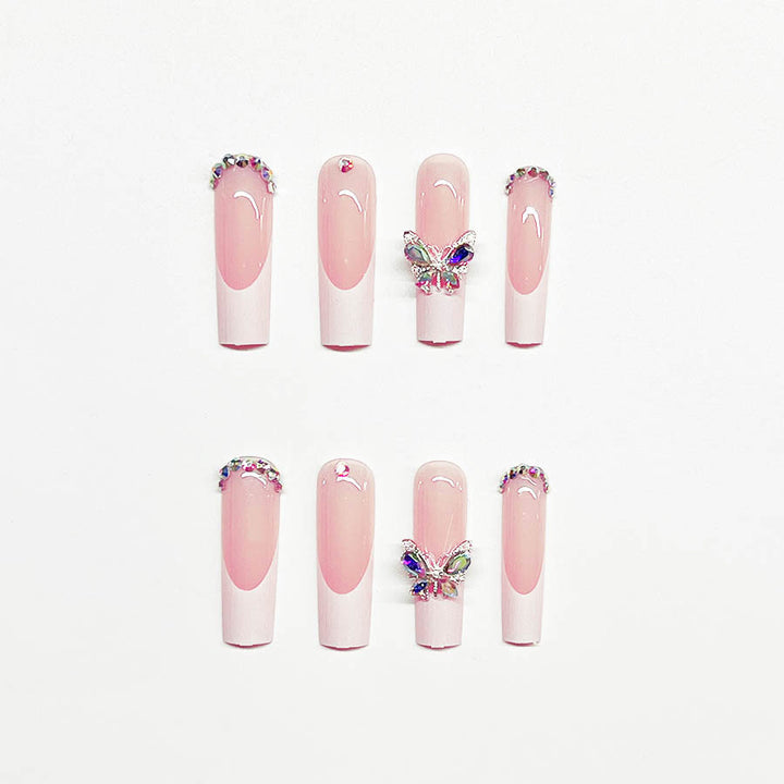 Acrylic nail set with elegant design and sparkling rhinestone accents Kalsten