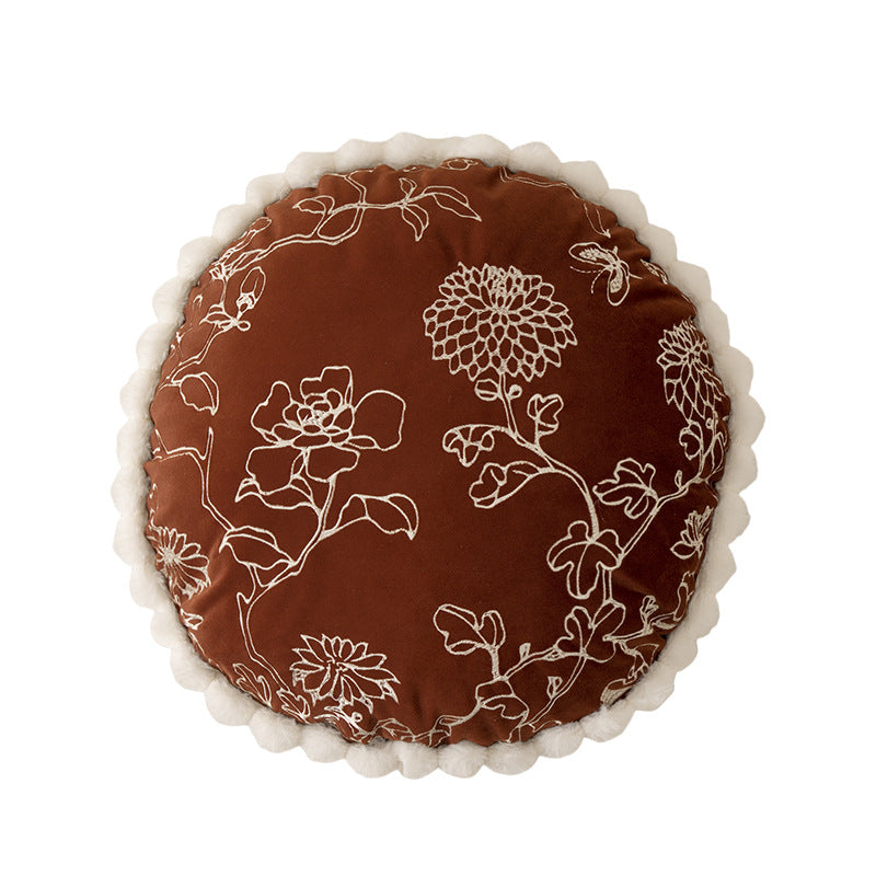 Round decorative cushion with floral embroidery relief look and wavy satin border Kalsten