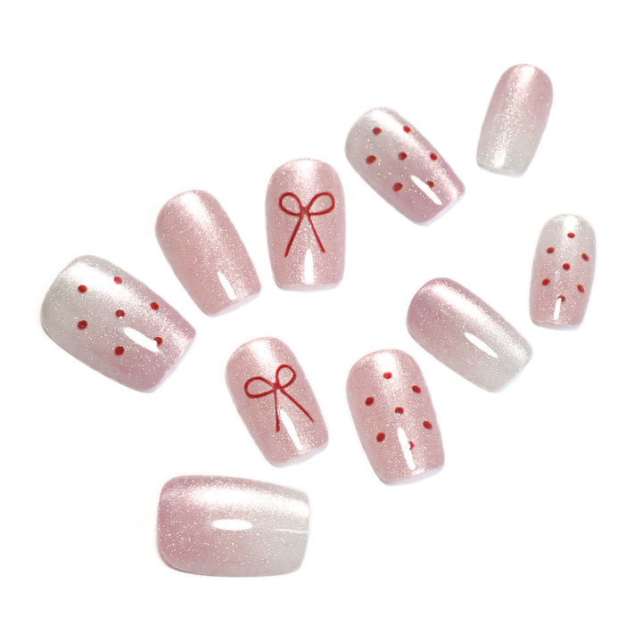 Artificial nail art with cute bow design Kalsten