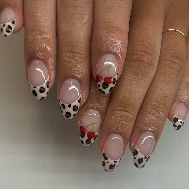 Artful animal pattern nails with cherry accents Kalsten