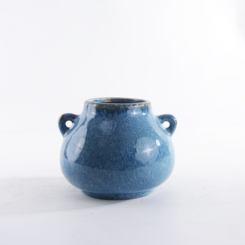 Decorative ceramic pot with playful handles Kalsten