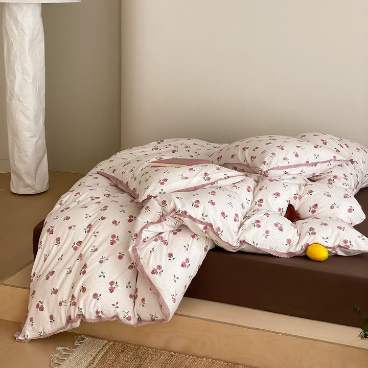 Finely woven cotton percale bedding set with delicate floral print and crocheted lace edge