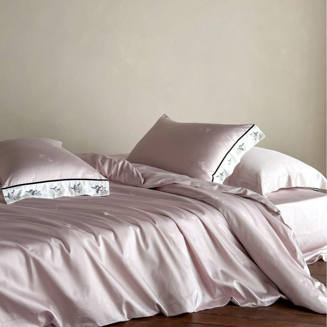 Luxurious cotton satin bedding set with embroidered hem and fine piping