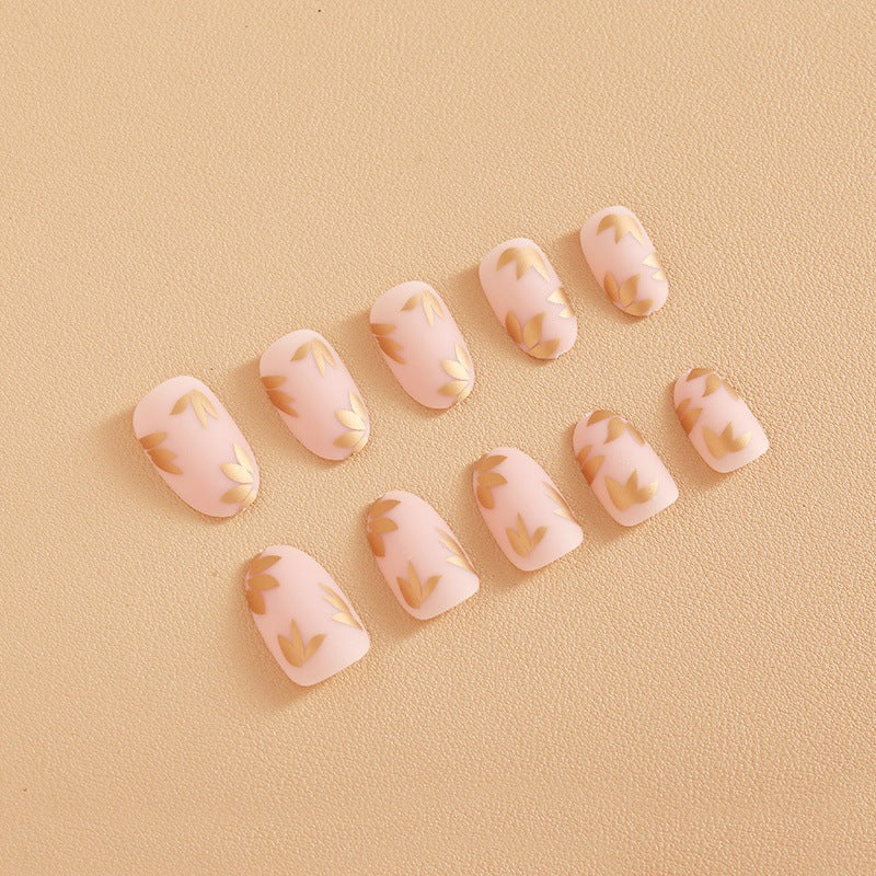 Artificial nail set with elegant gold leaf design Kalsten