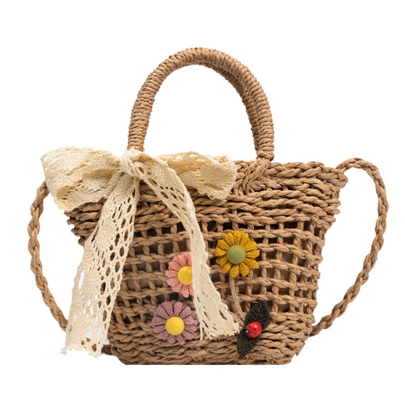 Playful basket bag with floral accents Kalsten