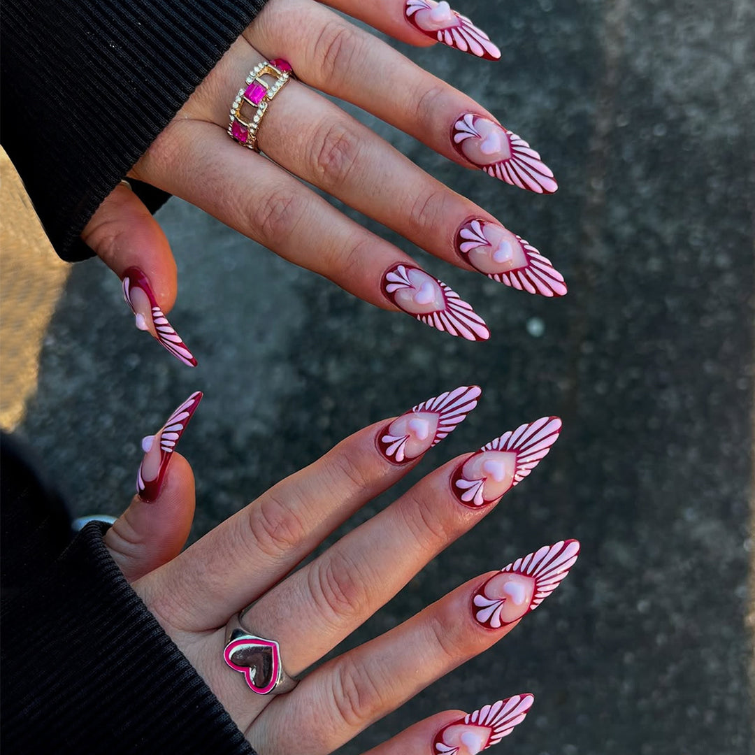 Artificial nails with playful heart design and elegant accents Kalsten