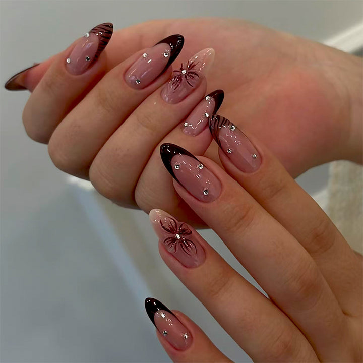 Artificial nails with elegant flower design and glitter accents Kalsten