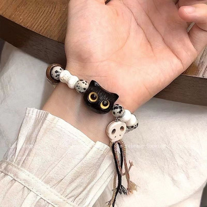 Whimsical Cat and Bone Charm Bracelet Kalsten