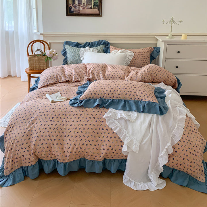 Romantic bed linen complete set made of cotton percale with delicate floral print, ruffle trim, and silky-matte finish