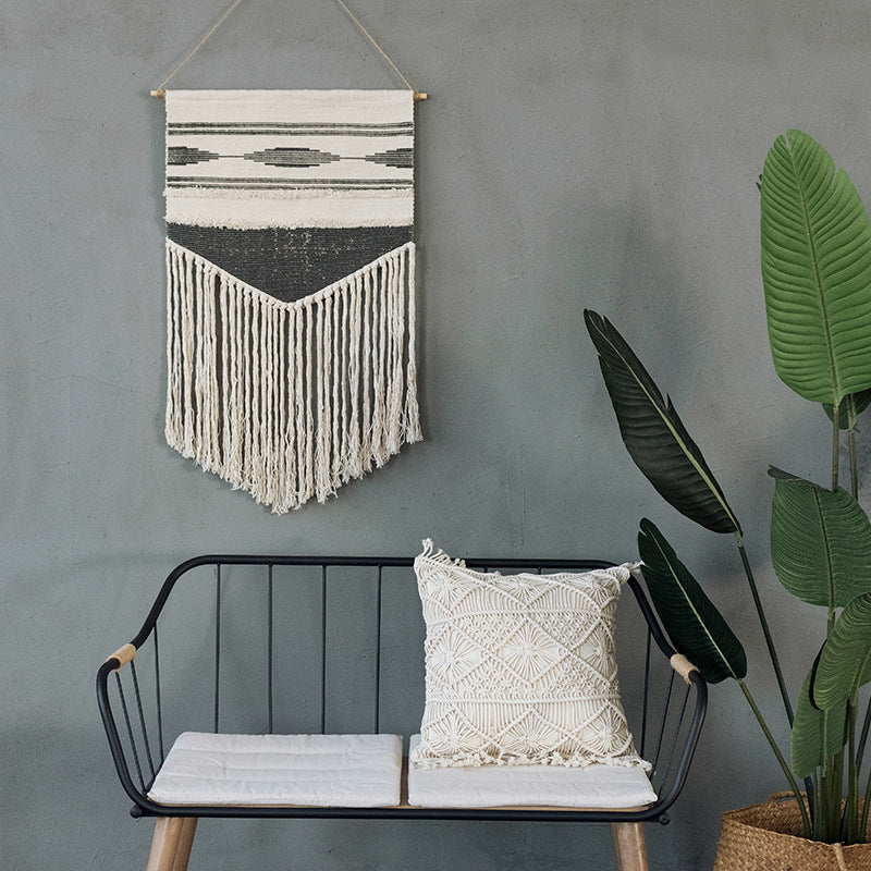 Handwoven wall hanging made of cotton blend with layered textures, wood rod and long fringes Kalsten