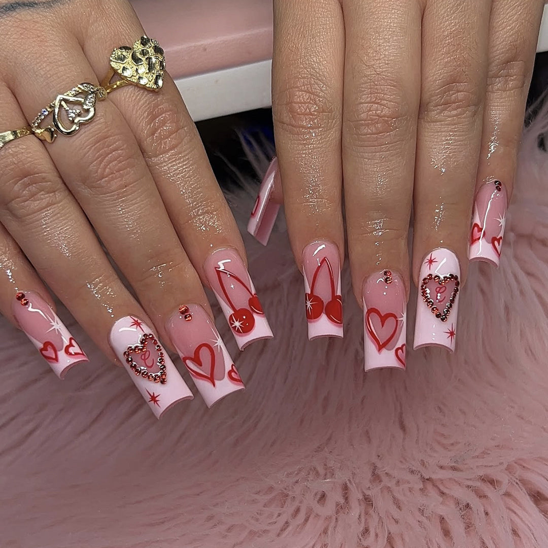 Artificial nail set with romantic heart designs and sparkling rhinestone decorations Kalsten