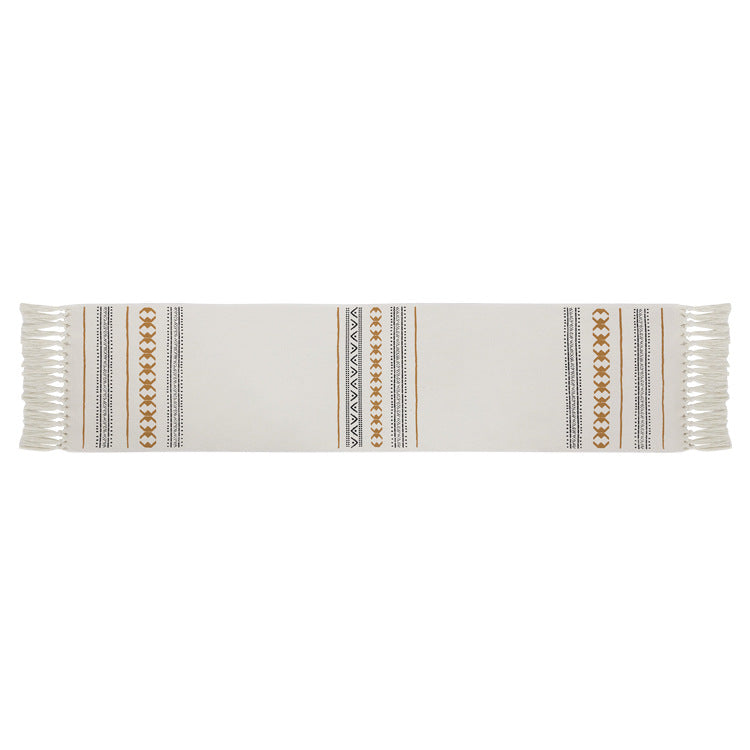 Woven Boho table runner made of cotton blend with decorative fringes and graphic stripe pattern Kalsten