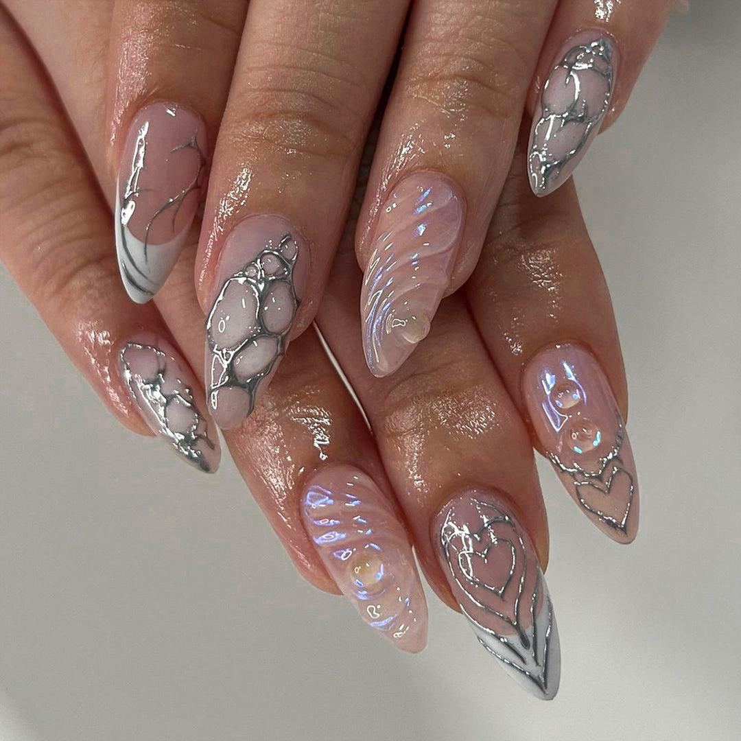 Elegant Stiletto Nail Extensions with Decorative Silver Accents Kalsten