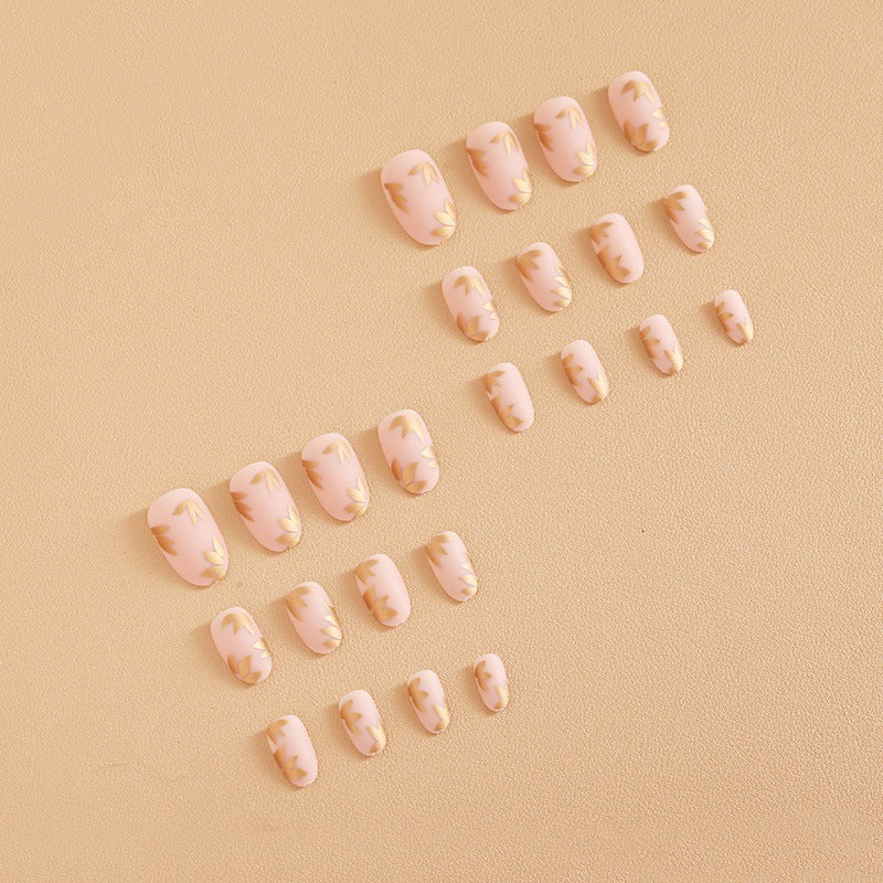 Artificial nail set with elegant gold leaf design Kalsten
