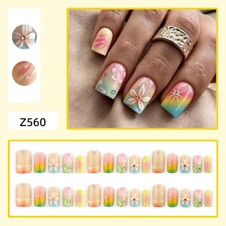 Artificial nails in vibrant floral design with glitter accents Kalsten