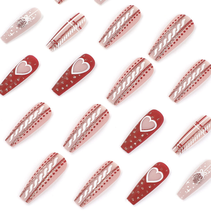 Artful nail art in festive design with heart and Christmas motifs Kalsten