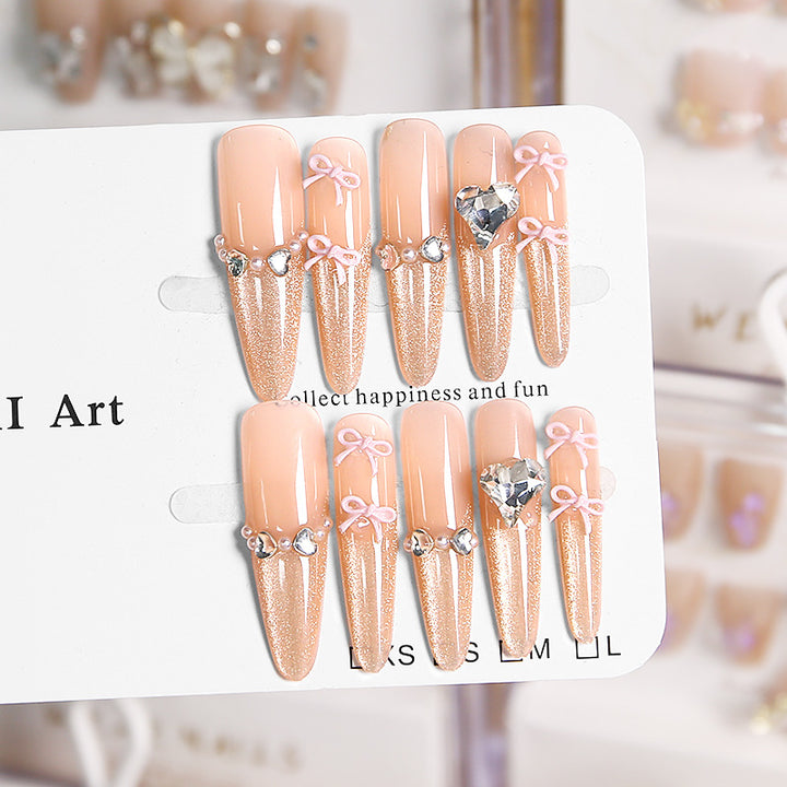 Art nail set with sparkling tips and delicate bow decorations Kalsten