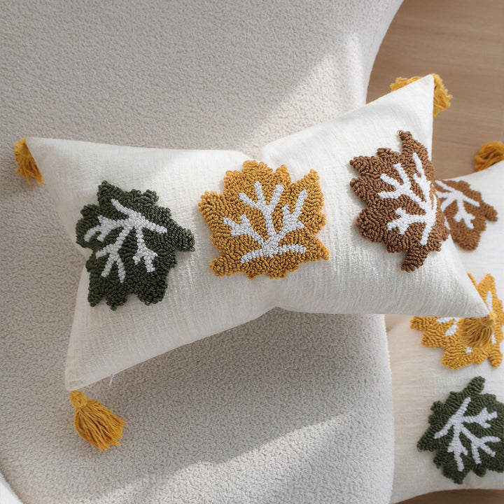 Rectangular decorative cushion cover made of linen look with raised leaf appliqués and corner tassels Kalsten