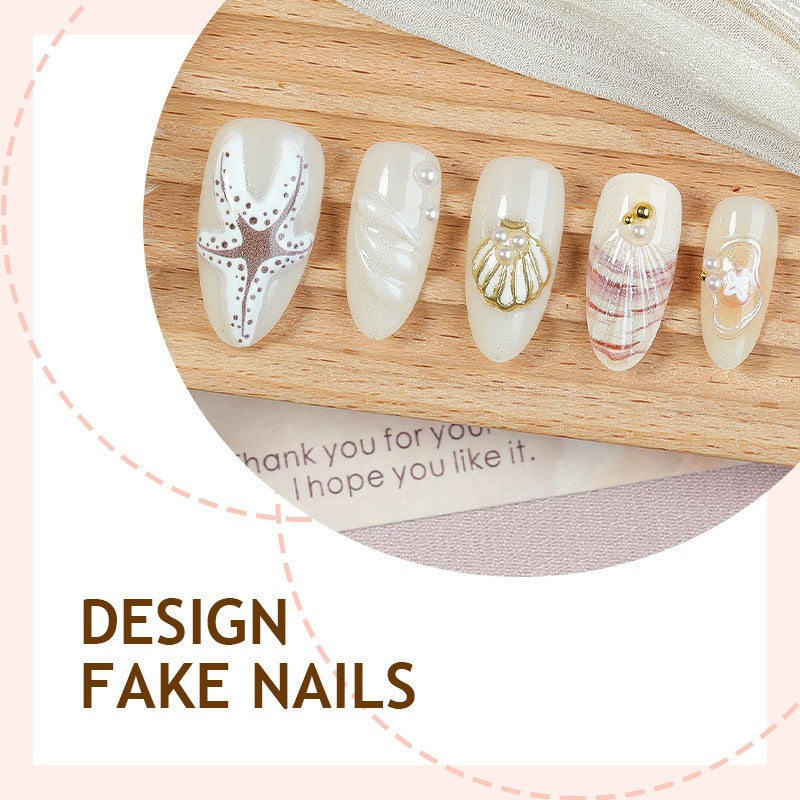 luxurious artificial nail set with maritime designs and golden accents Kalsten