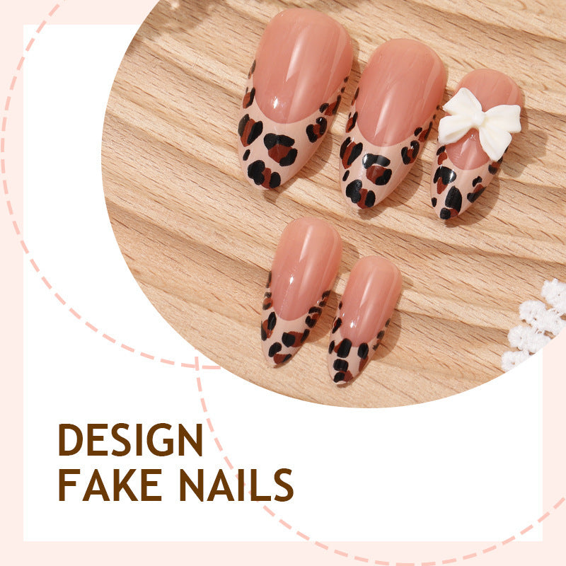 Creative nail art set with vibrant leopard pattern and delicate ribbons Kalsten