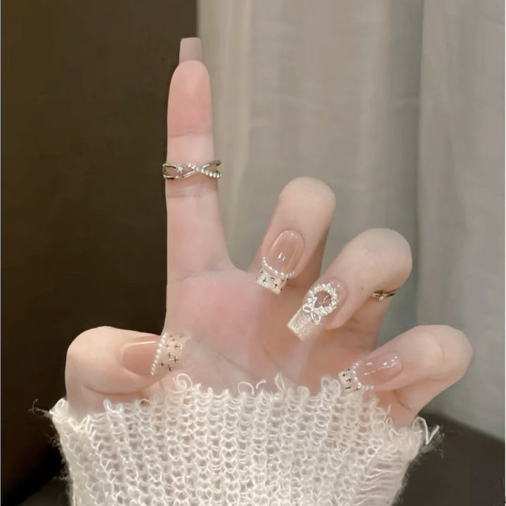 Glamorous artificial nails with sparkling decorations Kalsten