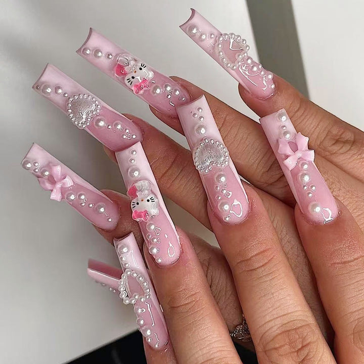 Artificial nail set with playful 3D care and pearl decorations Kalsten