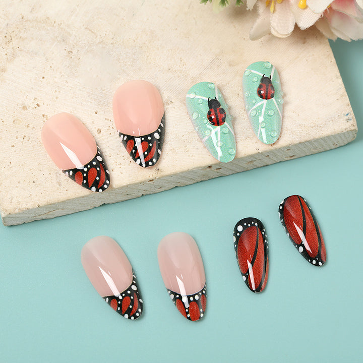 Creative nail art with elaborate butterfly and flower designs Kalsten