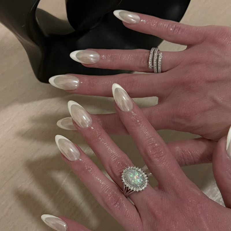 Artistic stiletto nails with elegant French tip embellishments Kalsten