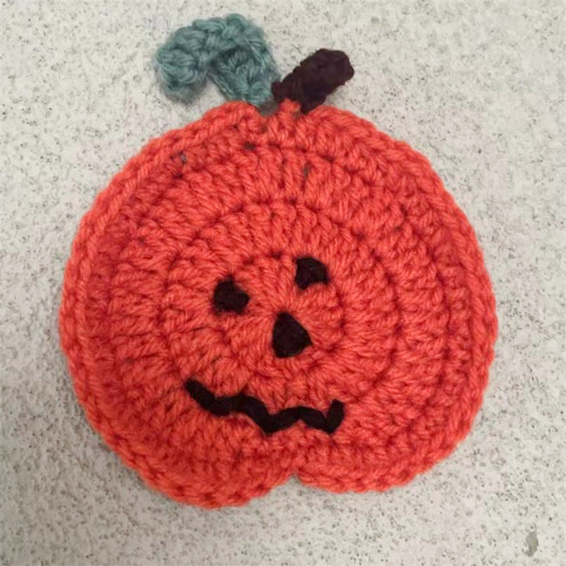 Hand-crocheted pumpkin pot holder and table mat made of cotton yarn