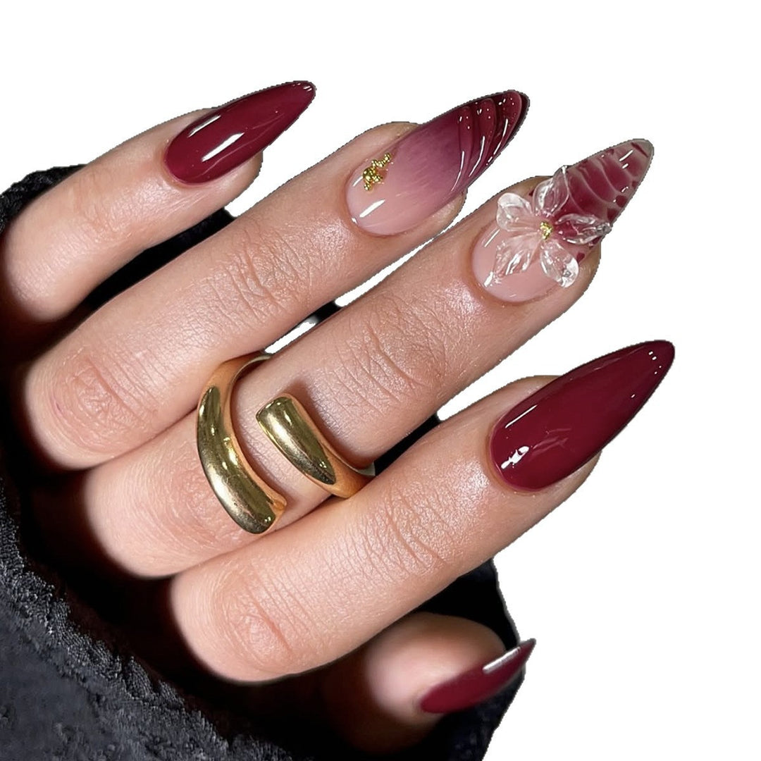 Artificial nail set with modern stiletto design and impressive flower appliqué Kalsten